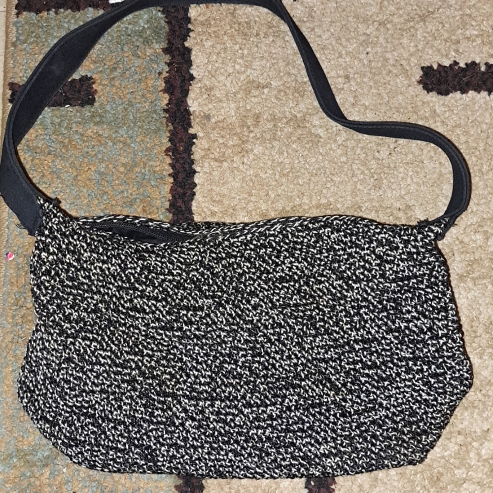 Ladies small black and white one pocket purse, black strap.